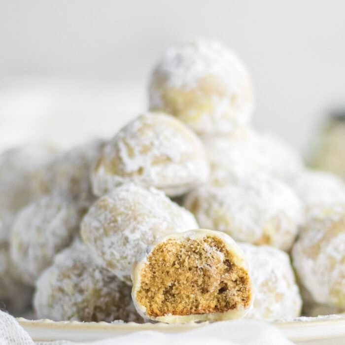 Closeup of the snowball cookies with one open to show the interior texture.