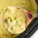 Closeup of a ladleful of soup being removed from the slow cooker.