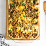 Closeup of the top of the casserole showing melted cheese.