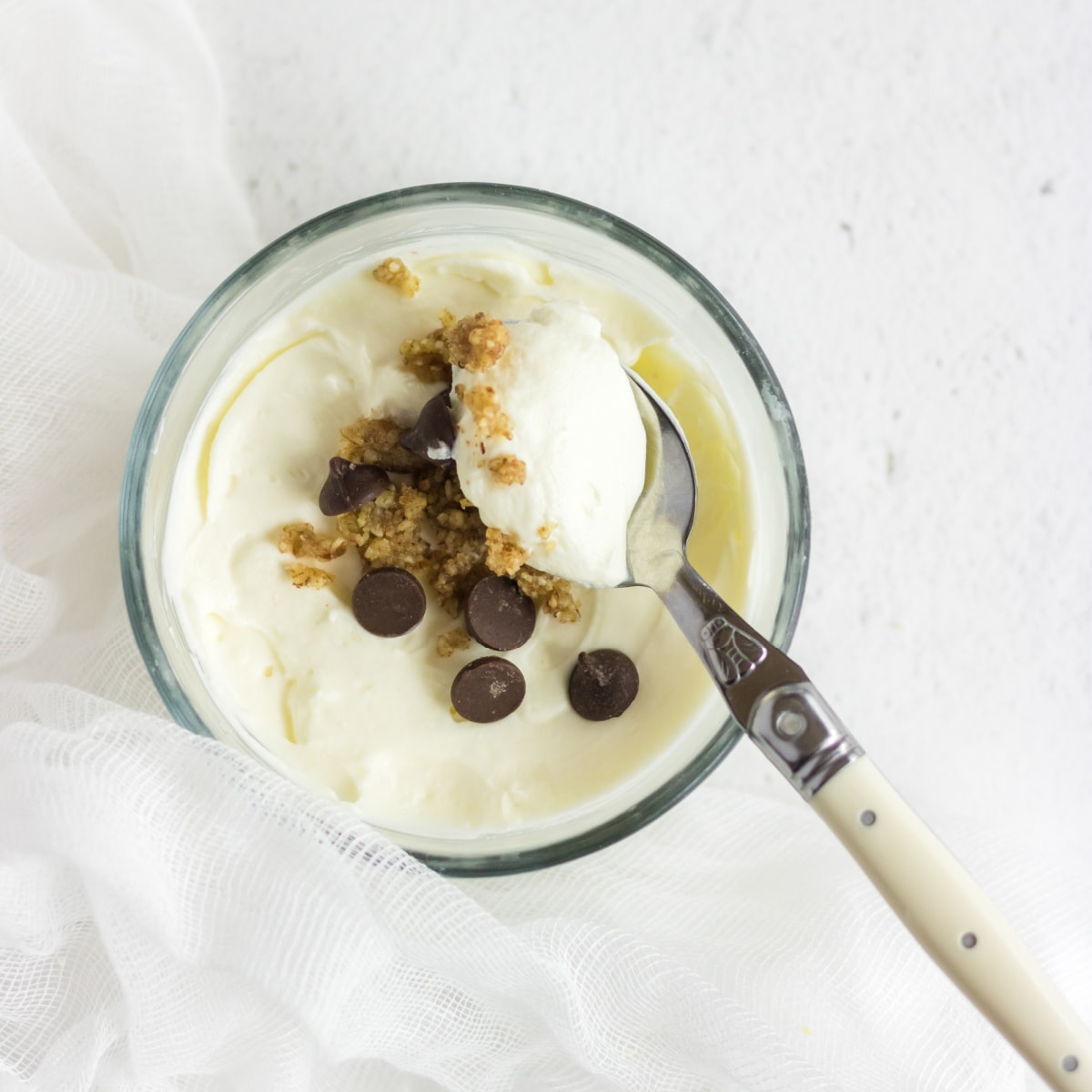 Overhead view of a spoonful of cheesecake showing creamy texture.