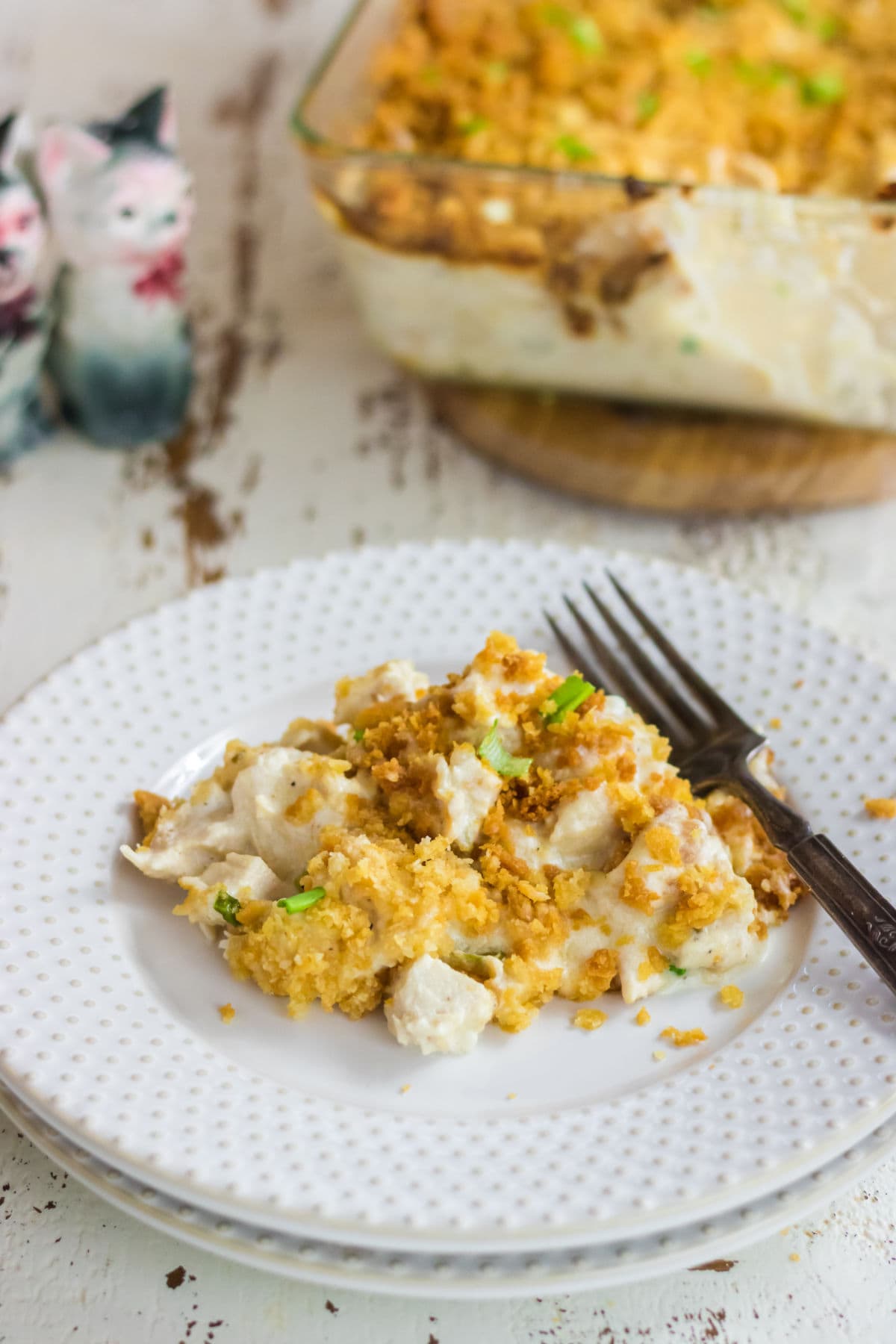 A white plate with a serving of the casserole on it.