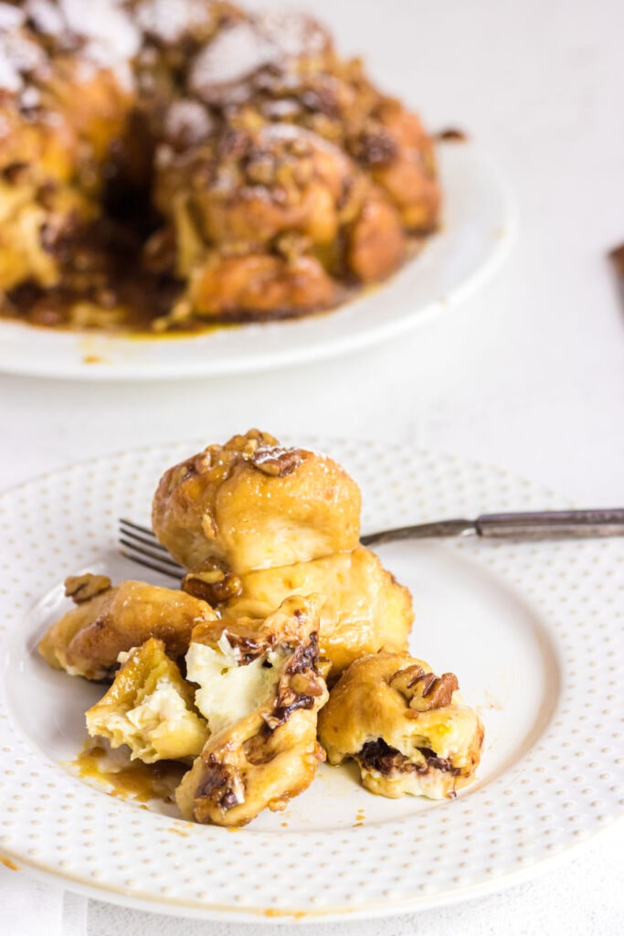 Piece of monkey bread cut open to show filling.