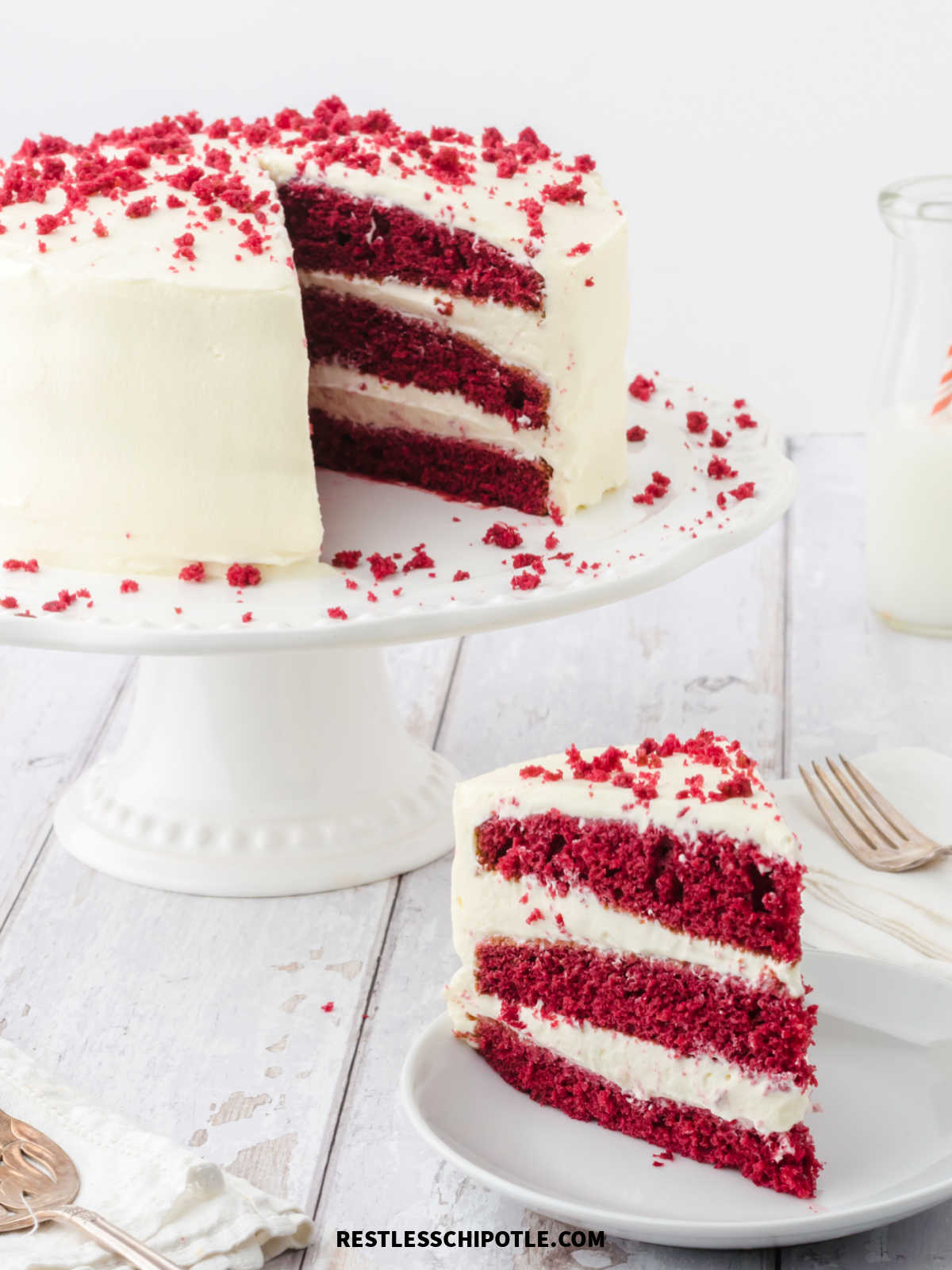 A slice of red velvet cake showing the layers.