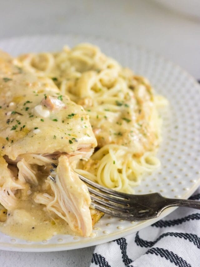 Close up of someone cutting into the chicken.