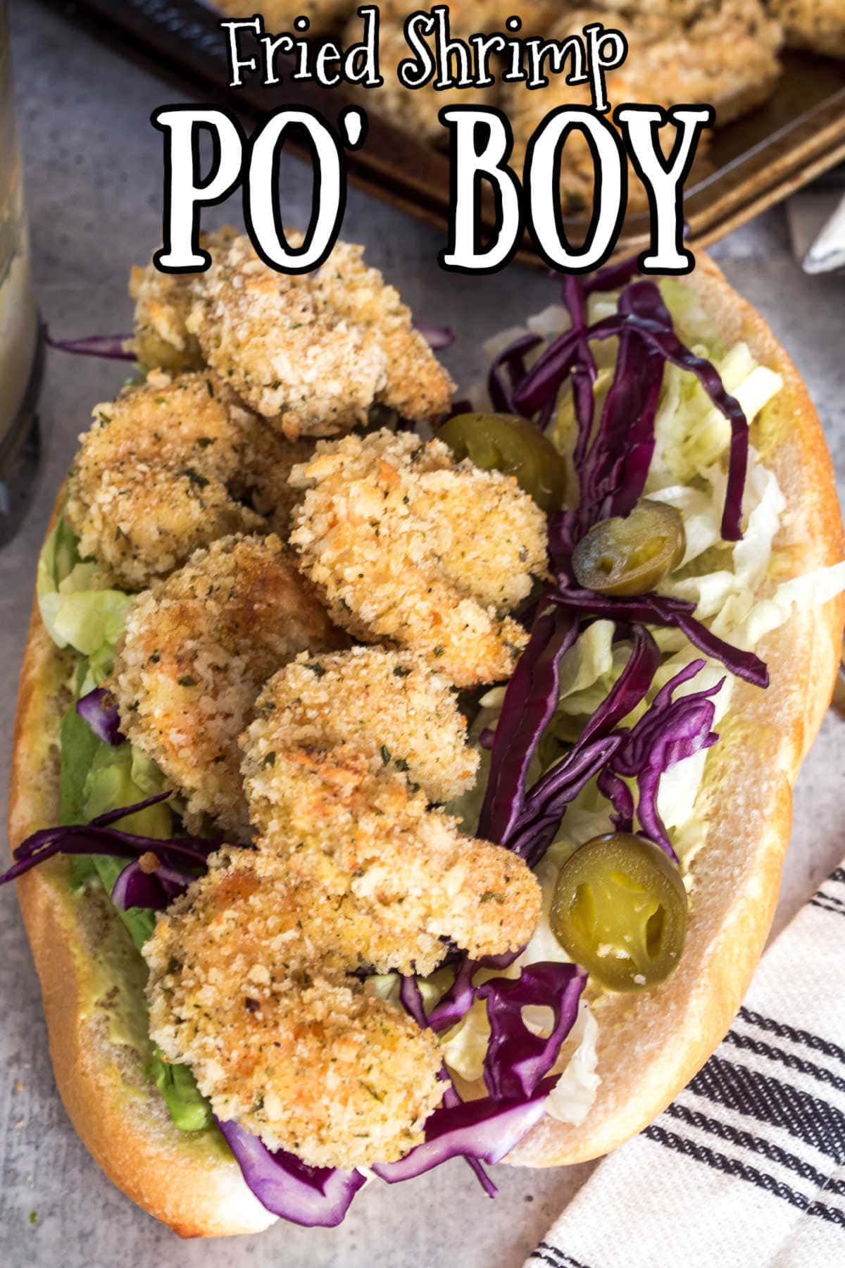 Overhead view of po' boy sandwich with title text overlay.