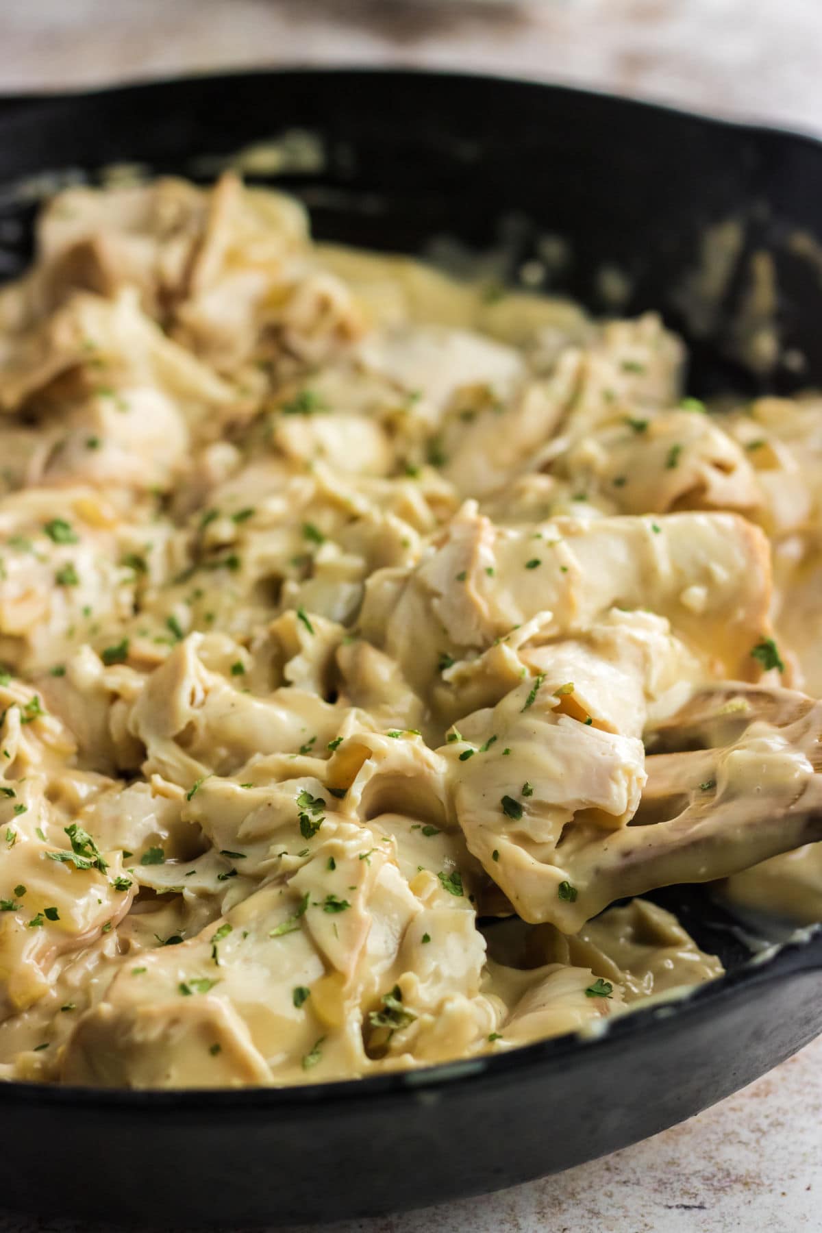 Turkey and gravy in a skillet.