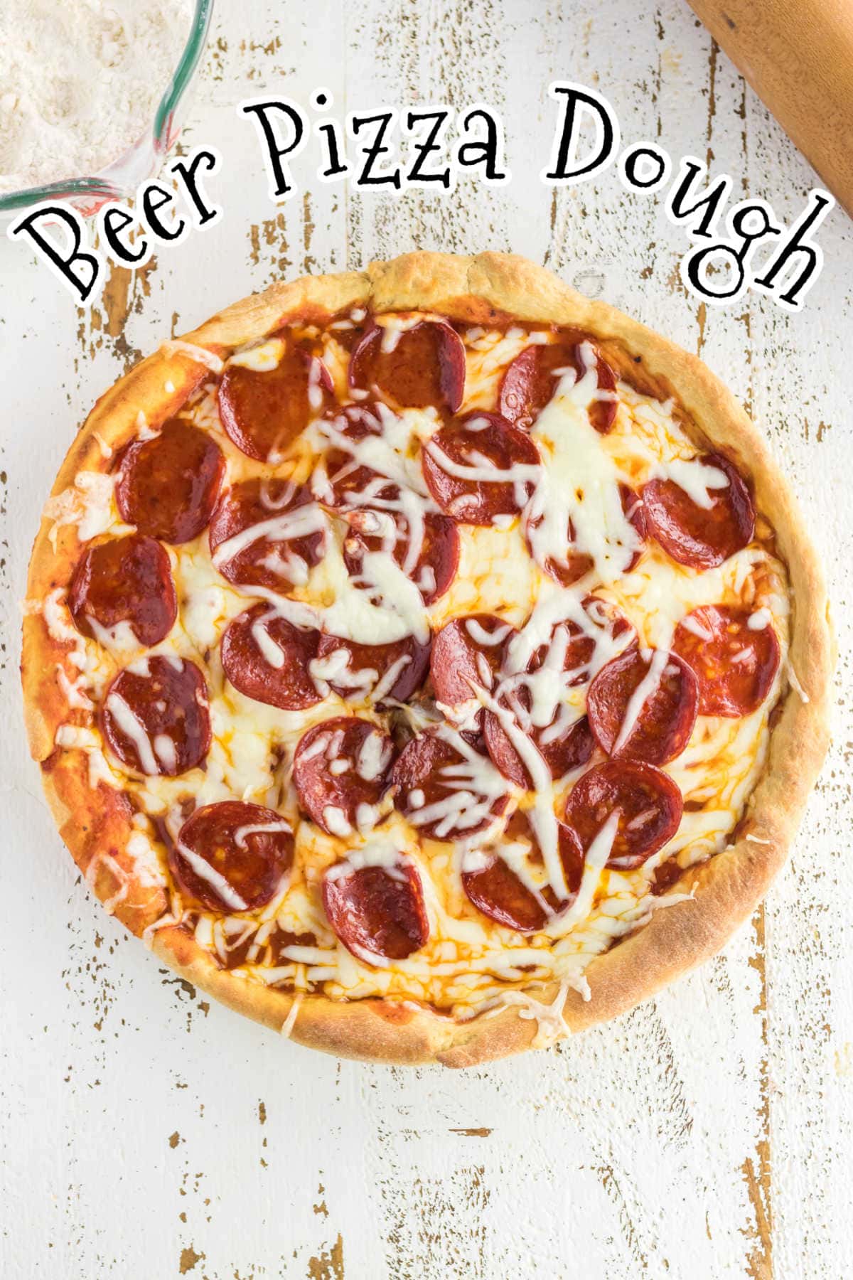 Overhead view of a baked pizza with title text overlay.
