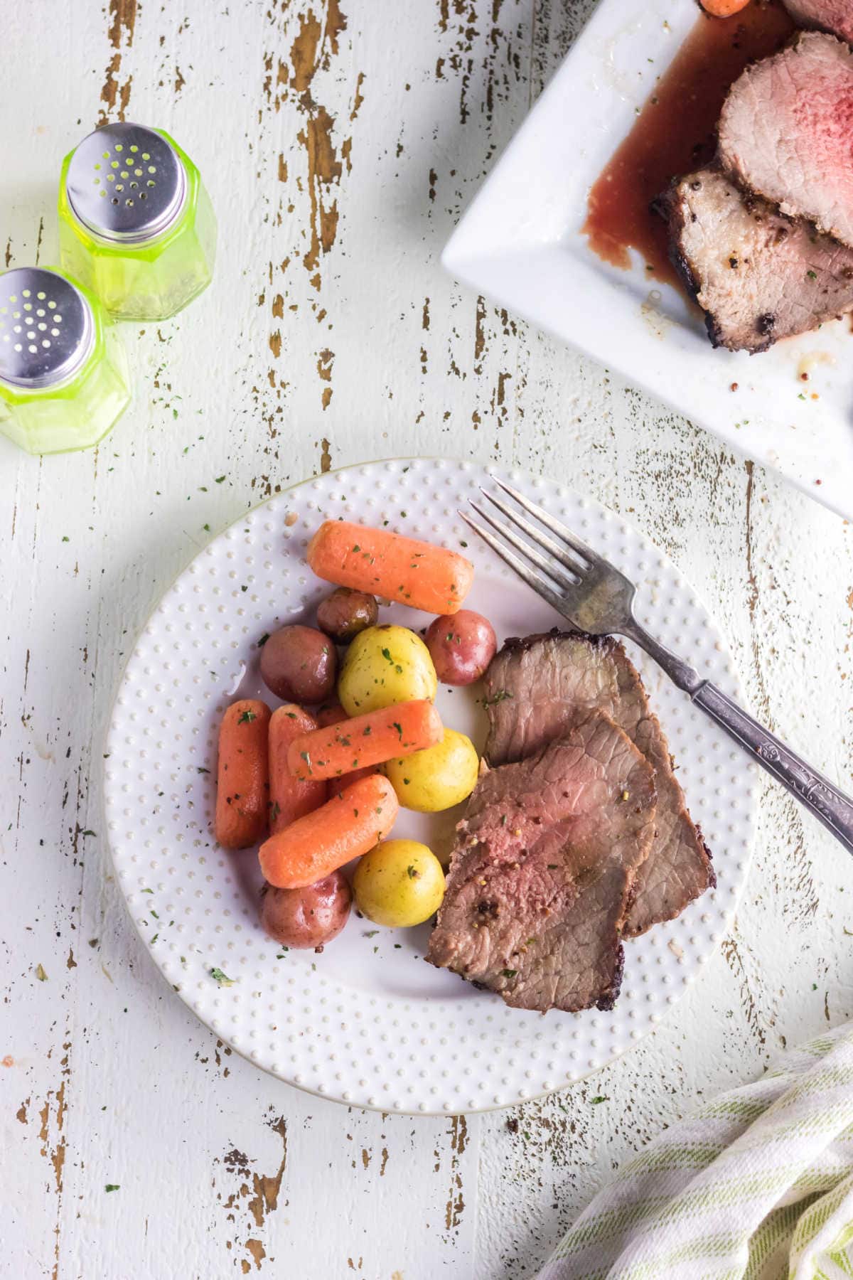 Overhead view of a plate of beef and vegetables.