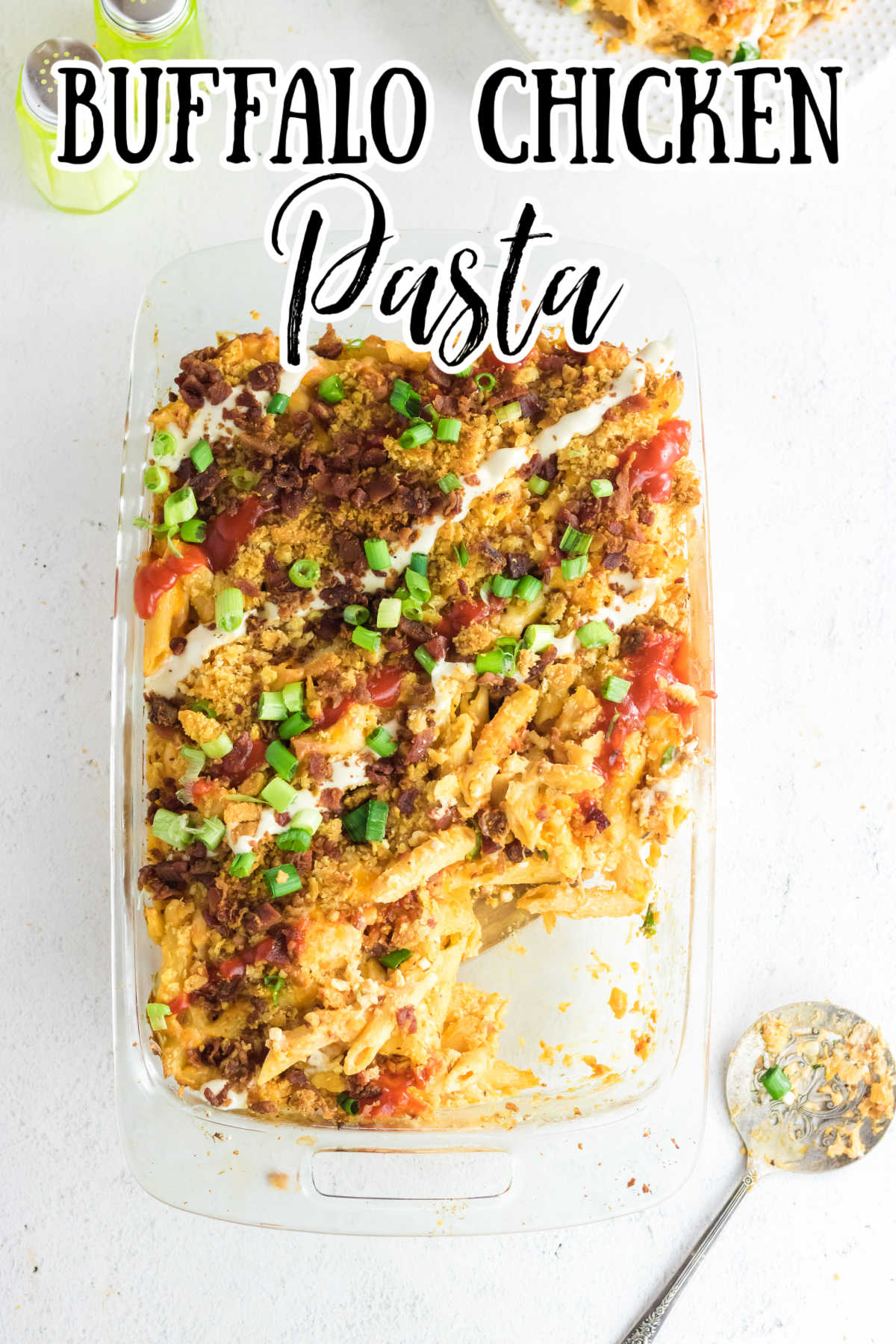 Overhead view of buffalo chicken pasta in a casserole dish with title text overlay.
