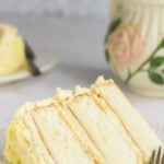 Slice of cake on a white plate with text overlay for Pinterest.