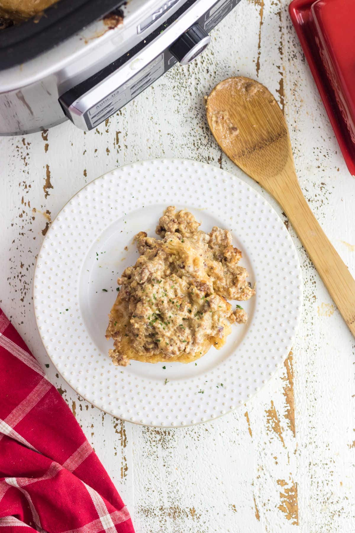 Overhead view of a serving of biscuits and gravy on a plate.