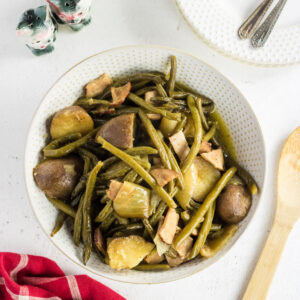 Overhead view of green beans and ham.