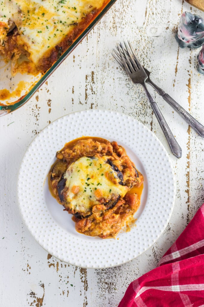 Overhead view of a plate of eggplant parmesan.