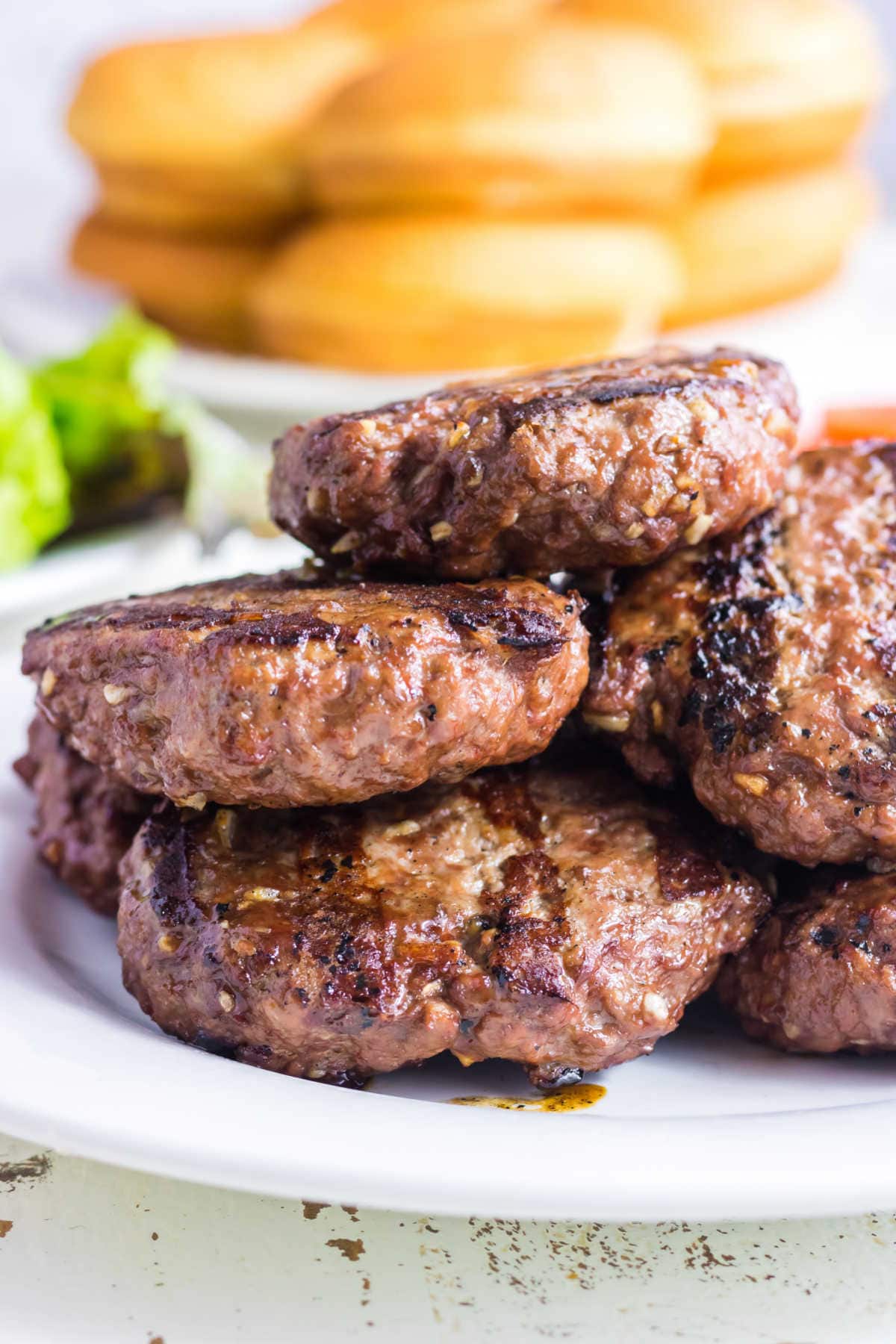 Closeup of grilled burgers ready to be eaten.