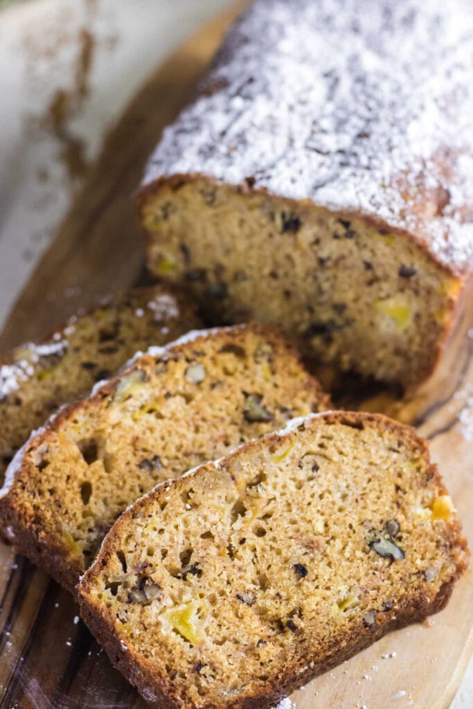 Closeup of a loaf of quick bread that has been sliced.