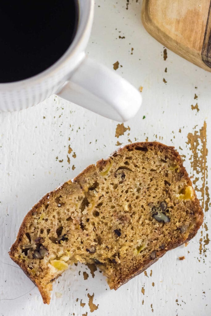 Overhead view of a slice of quick bread with a bite taken out.