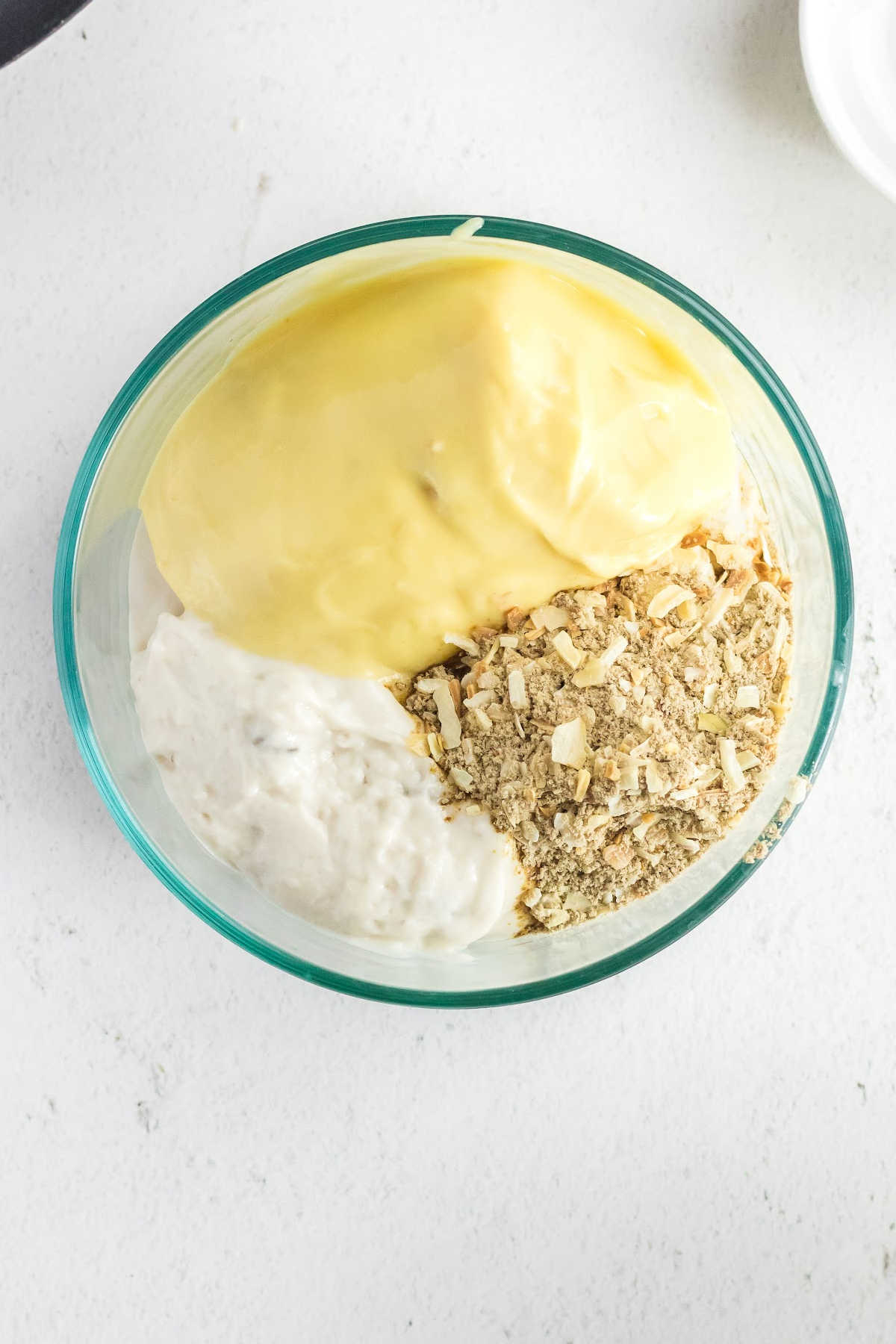 Cream soups and onion soup mix in a mixing bowl.
