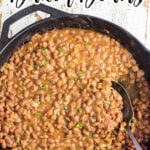 Baked beans in a pan with a text overlay for Pinterest.
