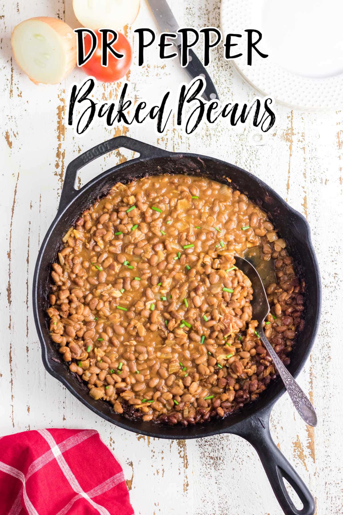Overhead view of baked beans in an iron skillet with title text overlay.