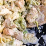 Closeup of chicken tortellini alfredo with text overlay for Pinterest.