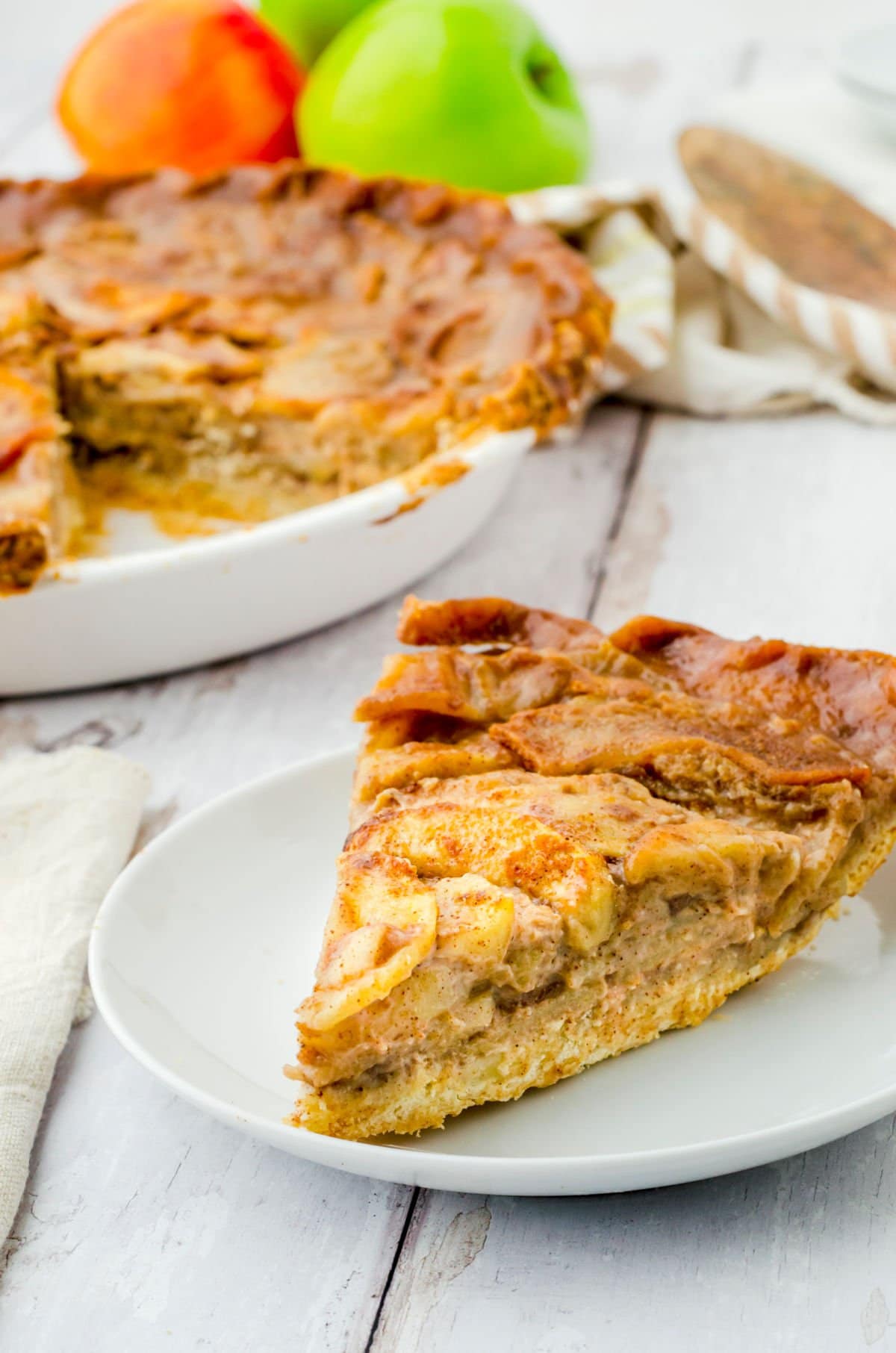 Side view of apple pie slice showing layers.