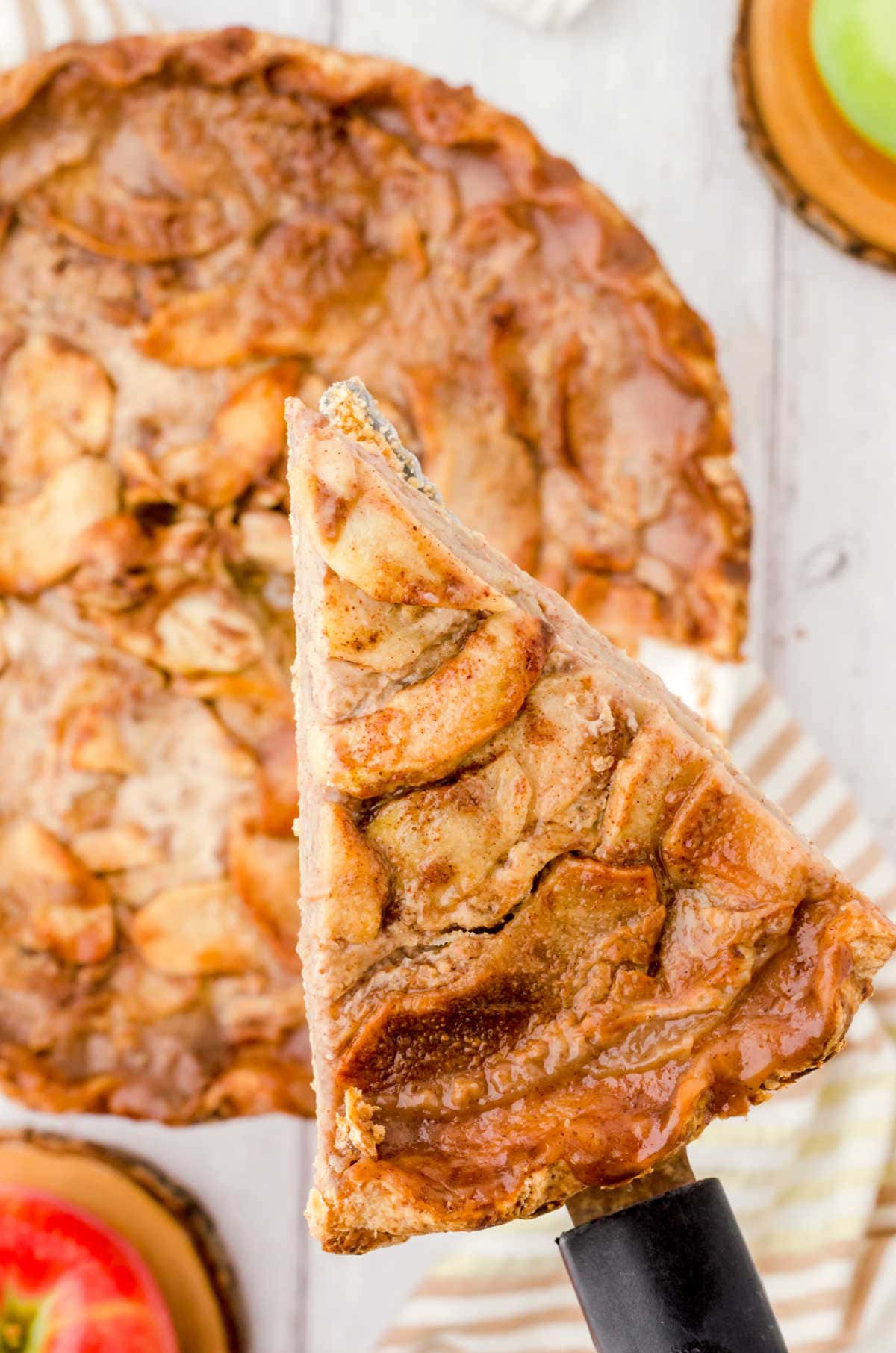 A slice of apple pie being served.