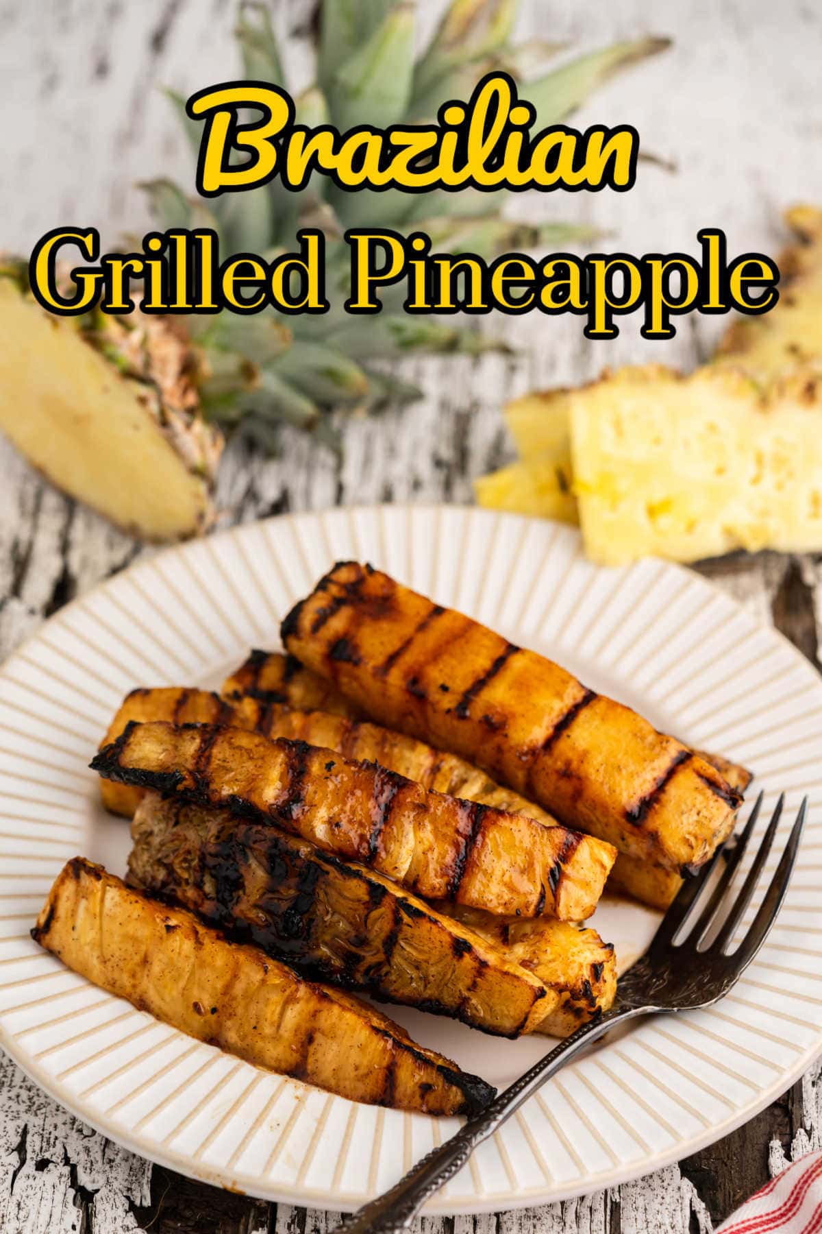 Grilled pineapple on a plate with title text overlay.