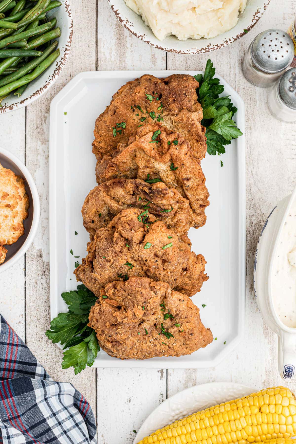 Overhead view of chicken fried steak on a serving plate..