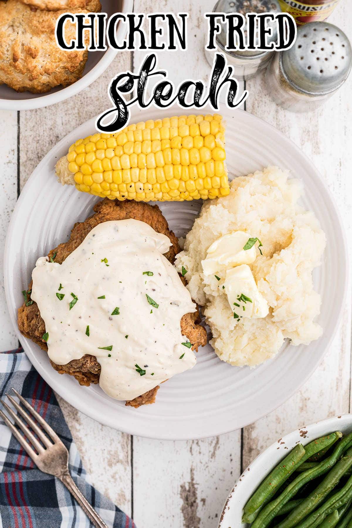 Overhead view of chicken fried steak with title overlay.