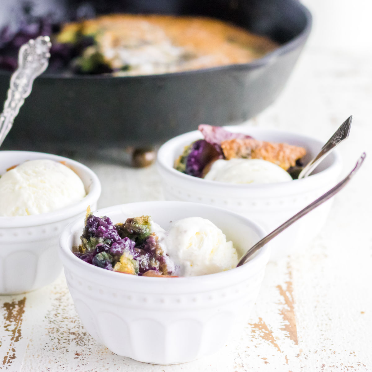 Closeup of a serving of cobbler and ice cream.