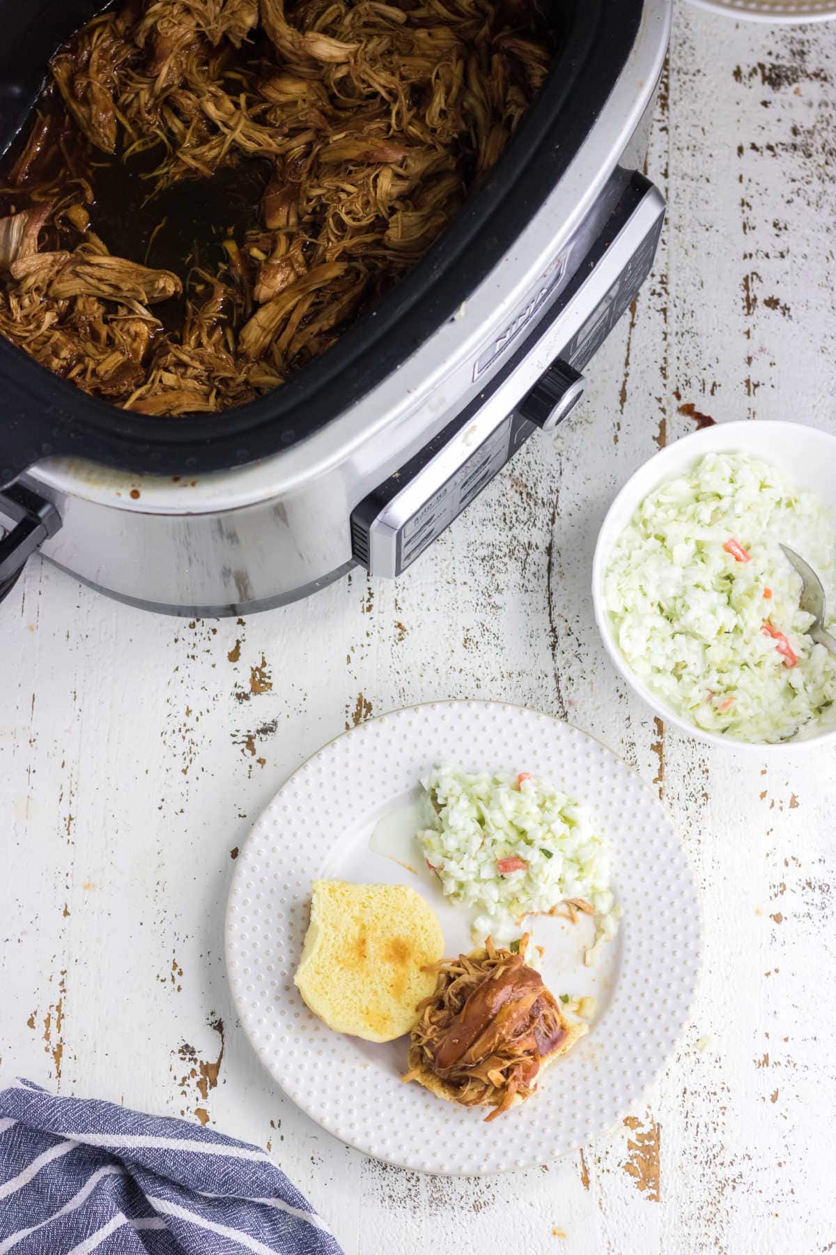 Overhead view of the chicken in the slow cooker.