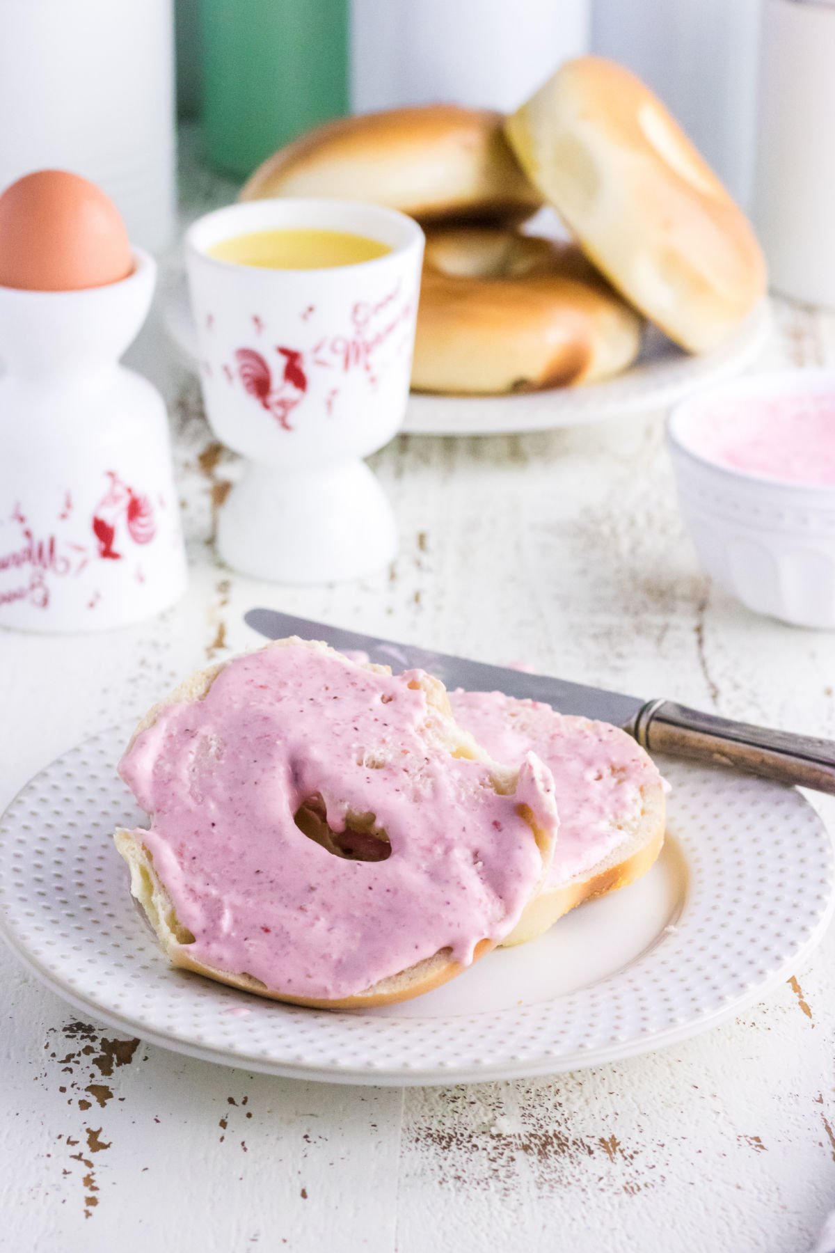 Strawberry cream cheese on bagels.