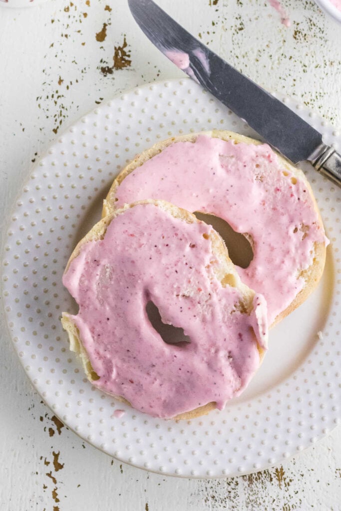 Strawberry cream cheese on bagels.