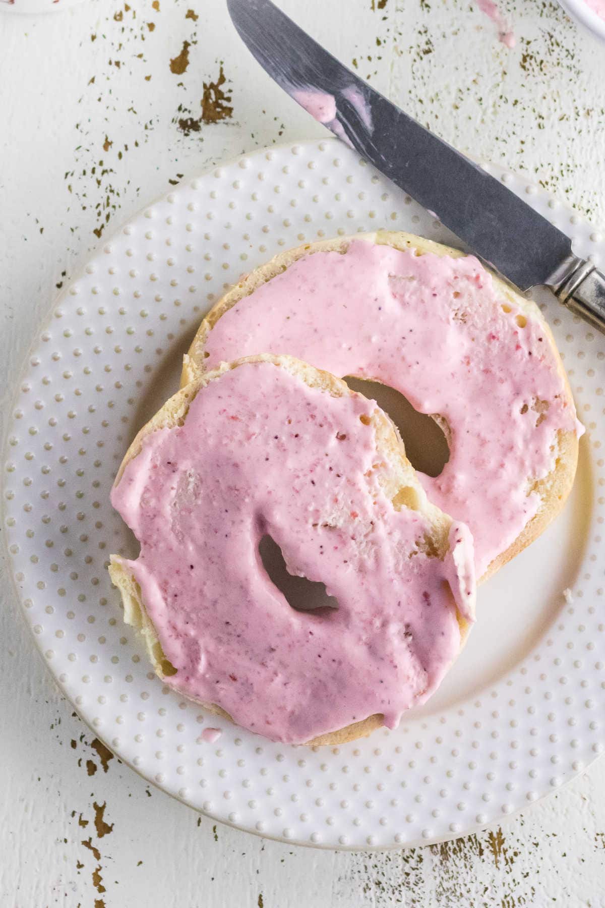 Strawberry cream cheese on bagels.