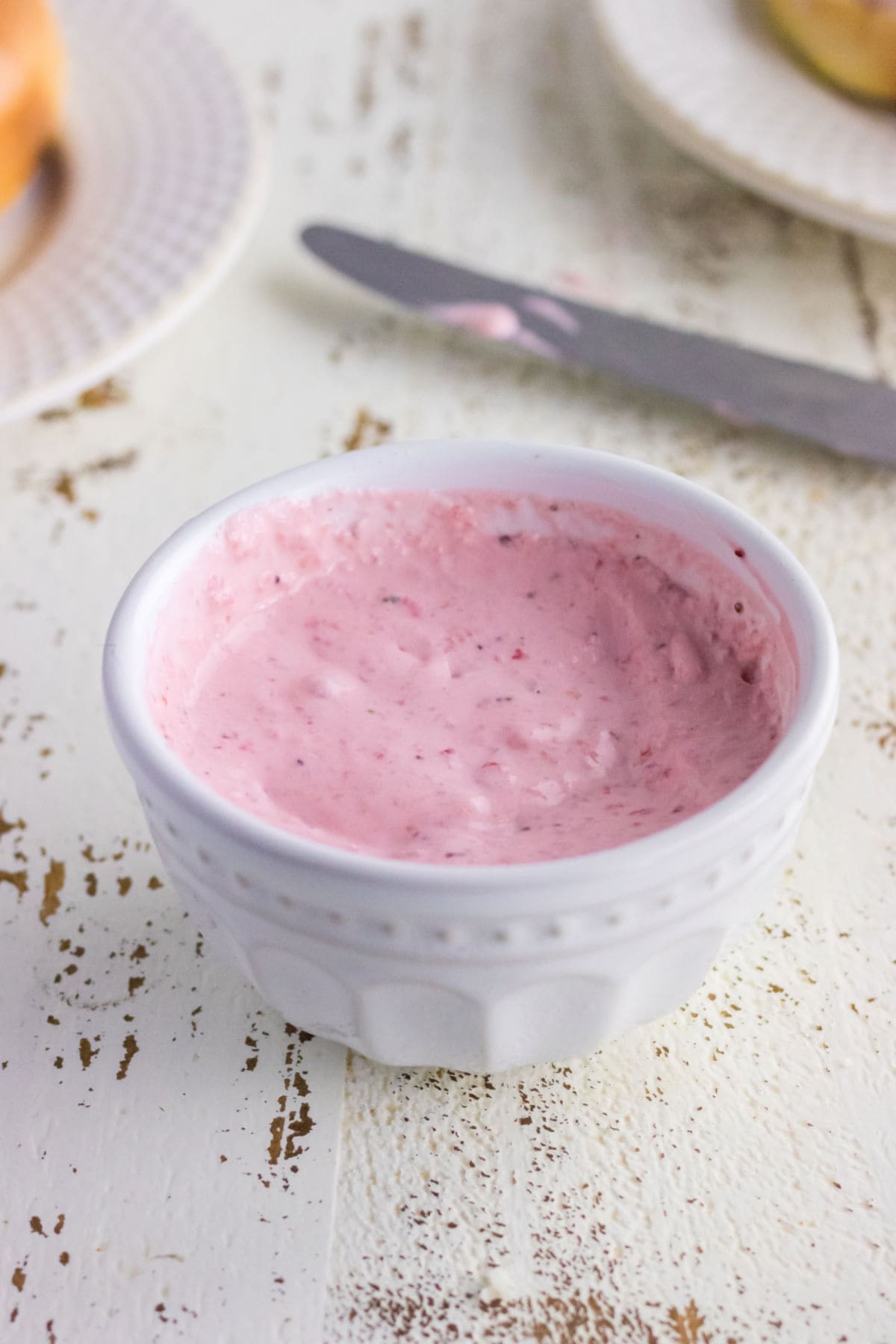 Closeup of strawberry cream cheese in a bowl.