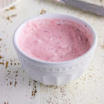 Closeup of strawberry cream cheese for the featured image.