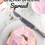 Strawberry cream cheese spread on bagels with text overlay for Pinterest.