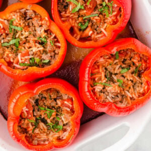 Stuffed peppers in a casserole dish for featured image.