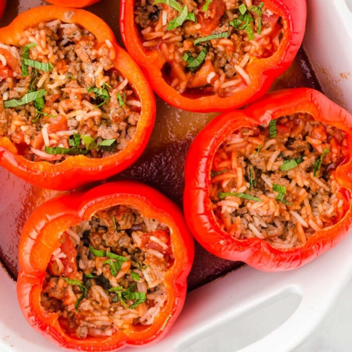 Stuffed peppers in a casserole dish for featured image.