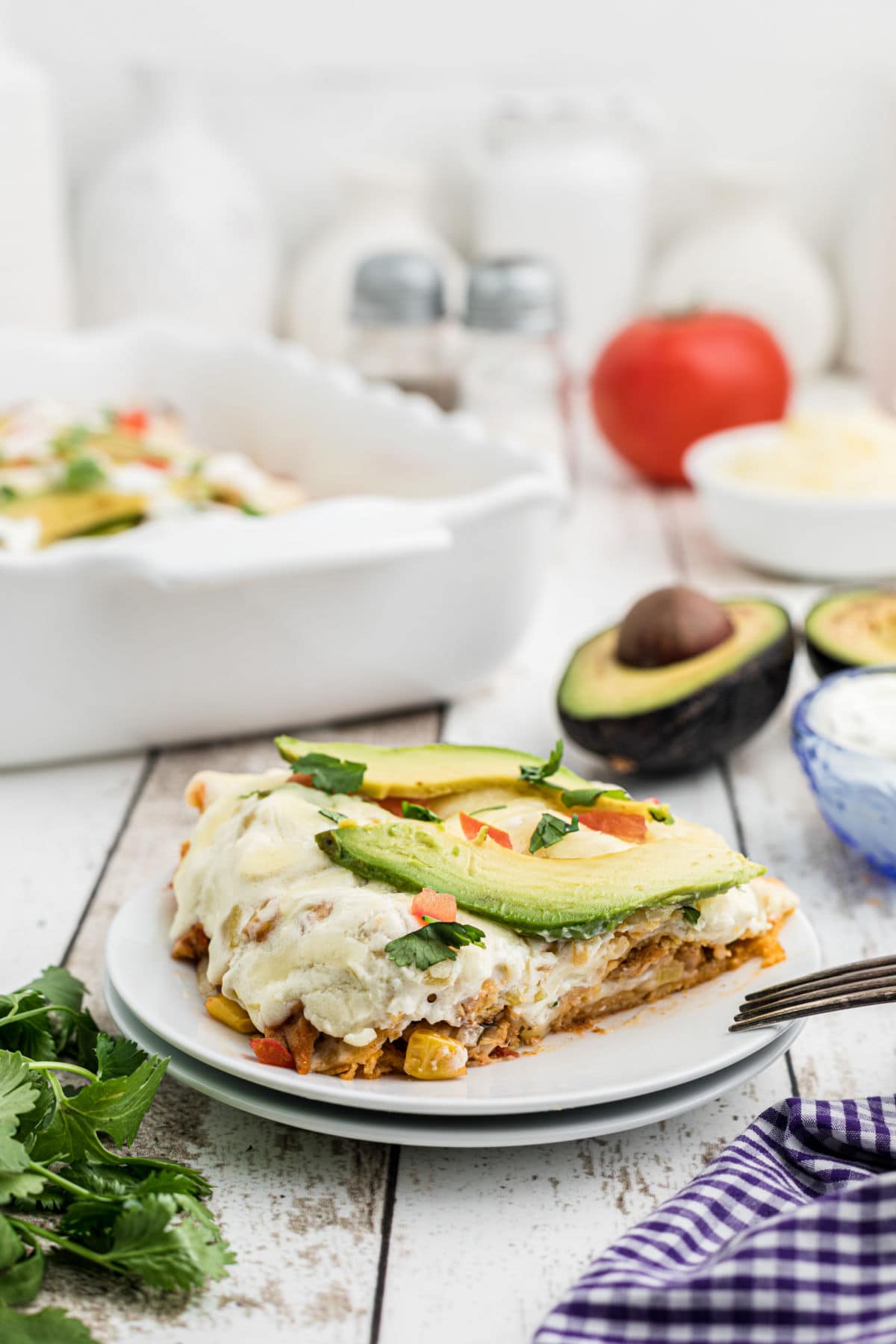 A serving of enchiladas on the table.