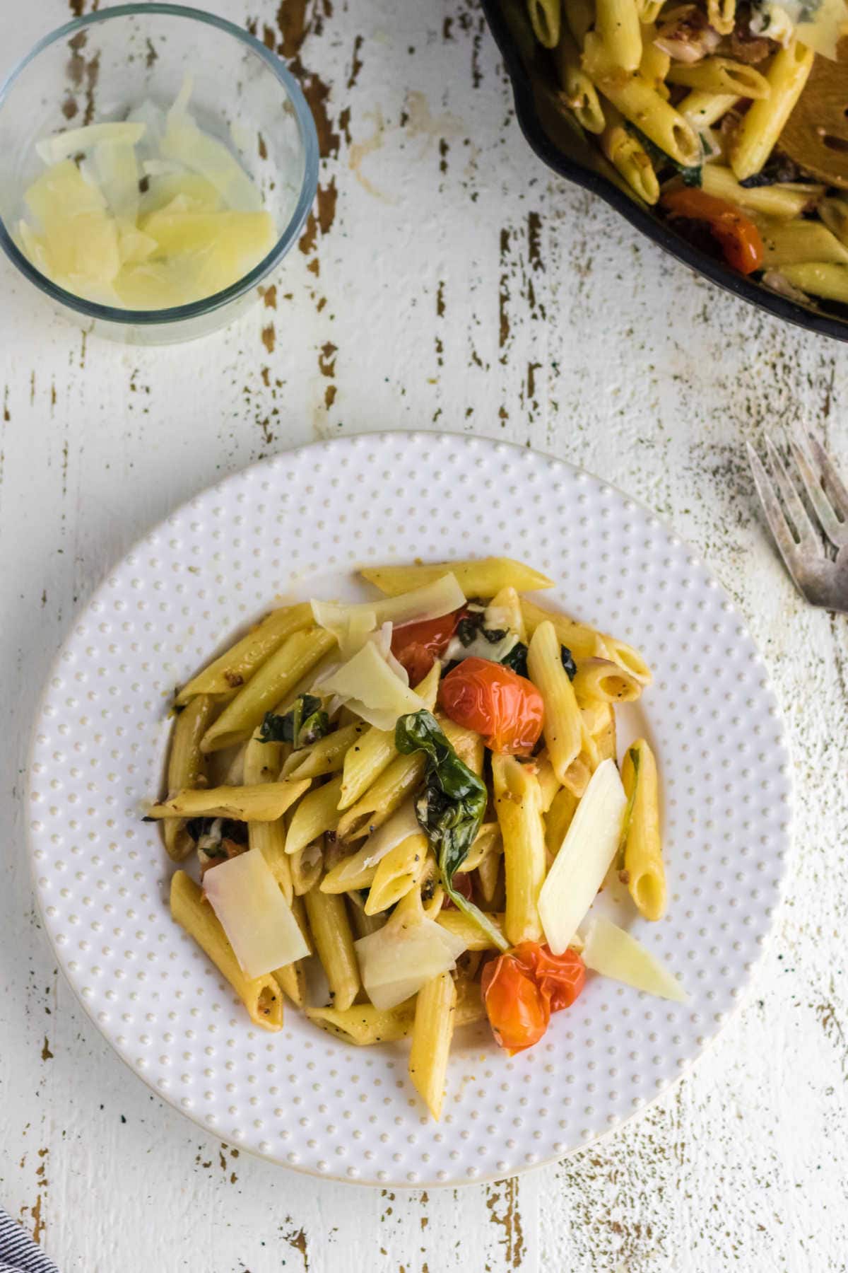 Overhead view of pasta on a white plate.