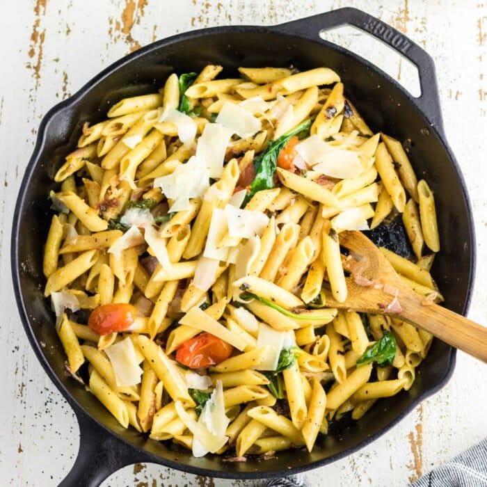 Overhead view of pasta in a pan for feature image.