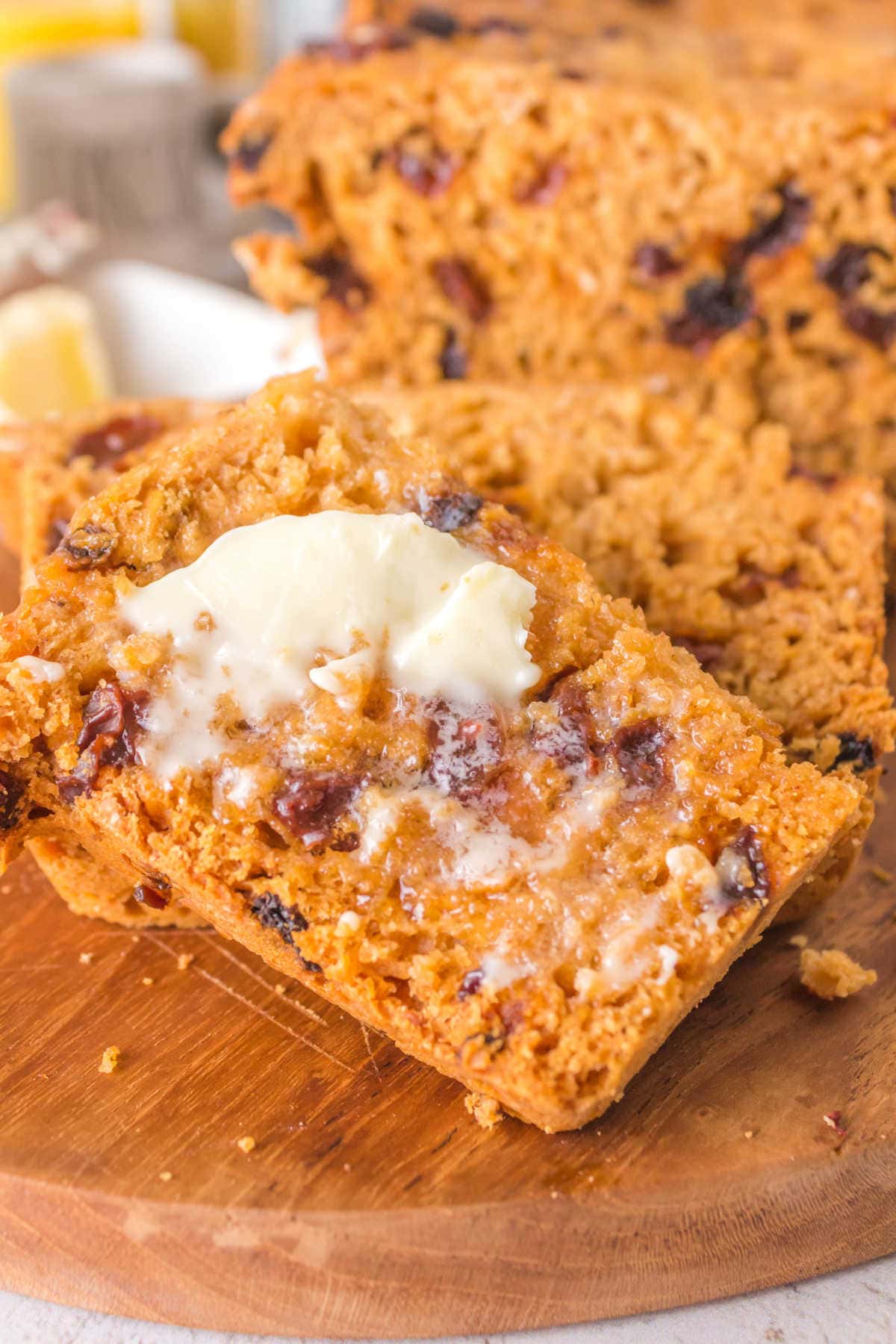 Slices of buttered cinnamon raisin bread.