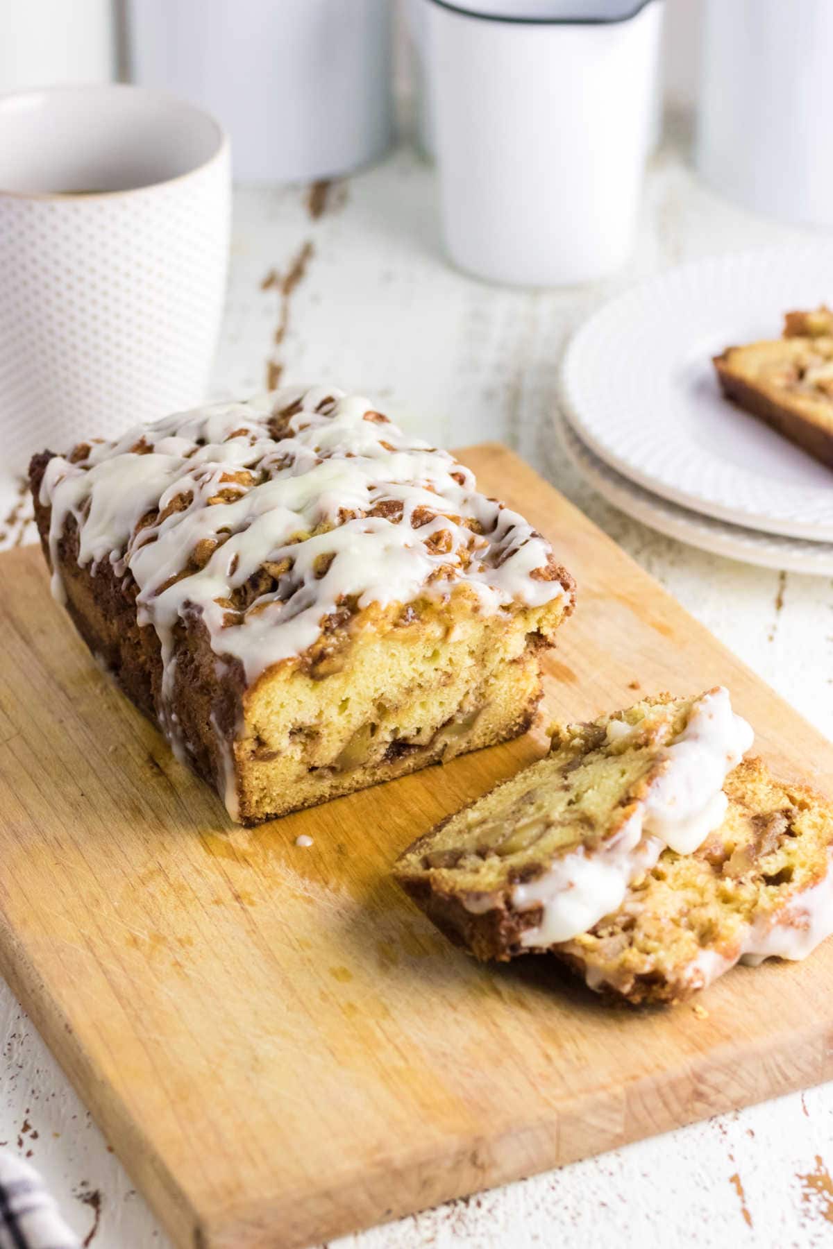 A loaf of apple bread on a cutting board