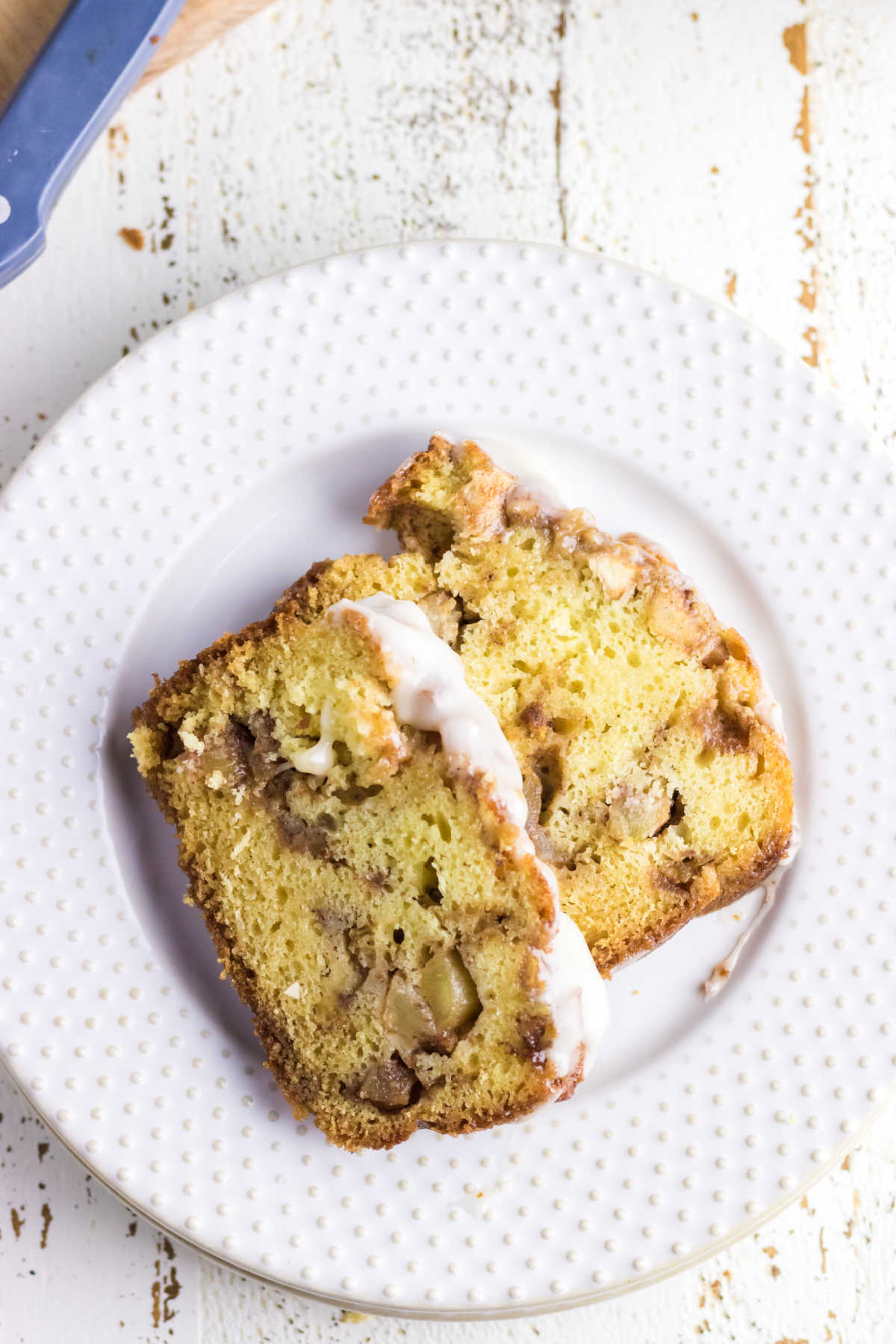 Two slices of apple bread on a plate.