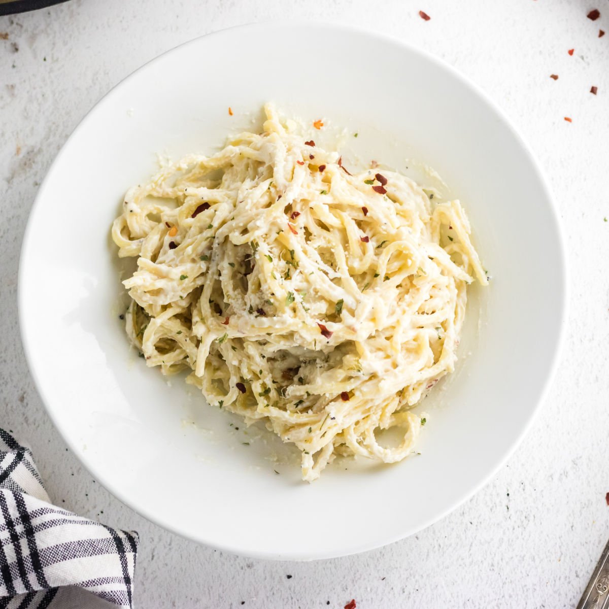 A bowl of cream cheese pasta.