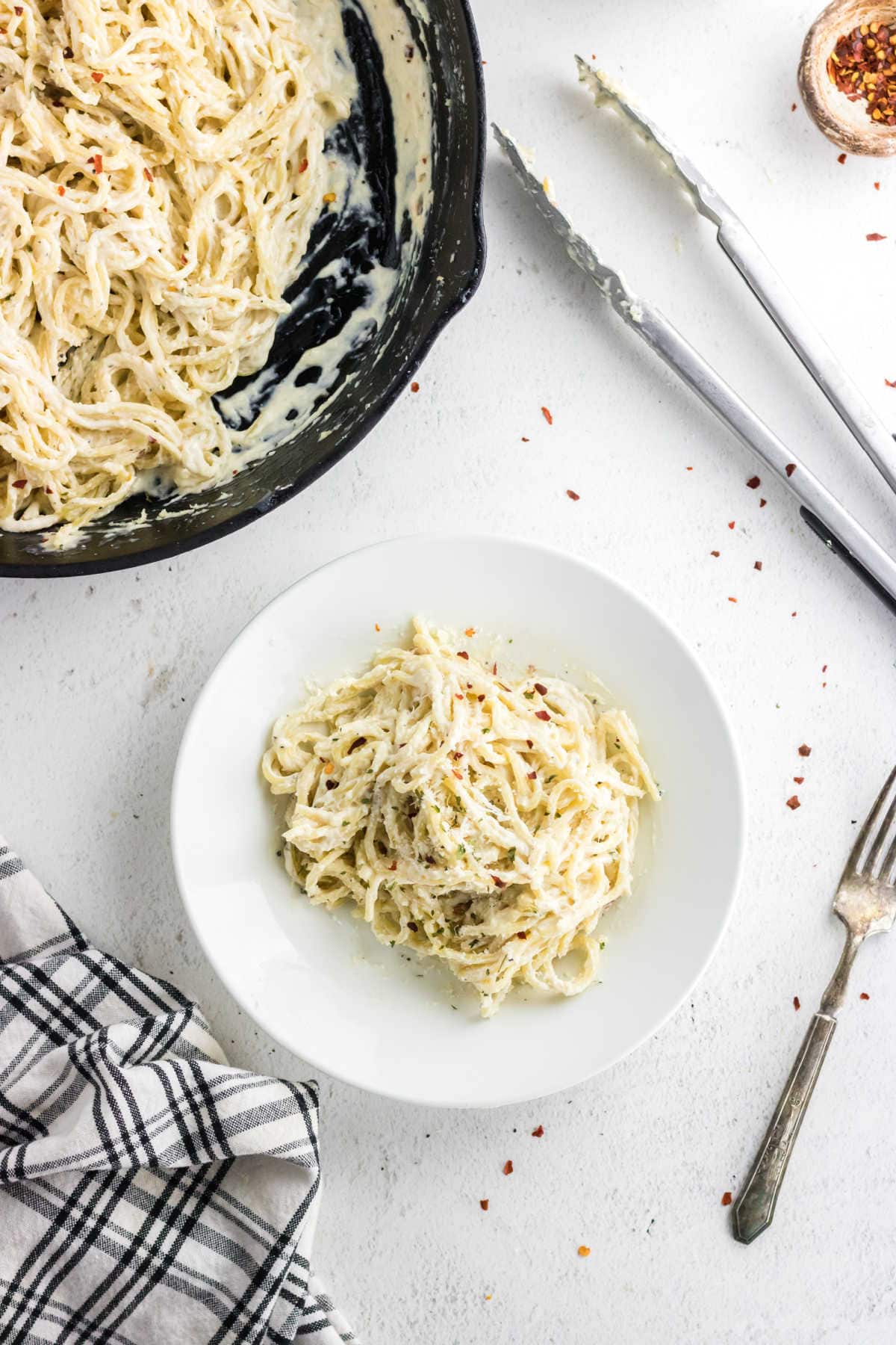 Cream cheese pasta in a skillet.