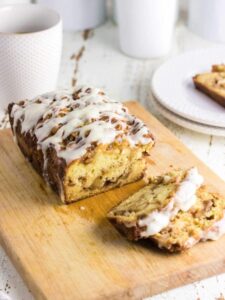 A loaf of apple bread on a cutting board