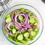 Cucumber salad with text overlay for Pinterest.