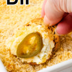 Jalapeno cream cheese dip on a cracker with text overlay for Pinterest.